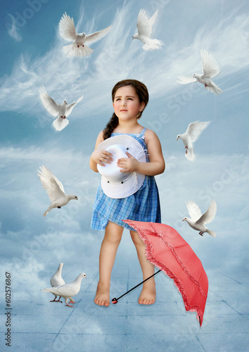 Little girl looking at the doves in the sky