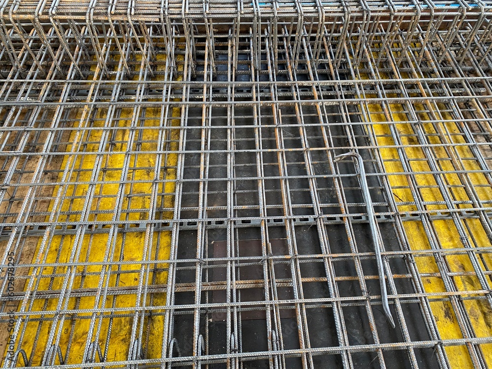 binding of reinforcement of a monolithic reinforced concrete slab of a residential building before pouring concrete