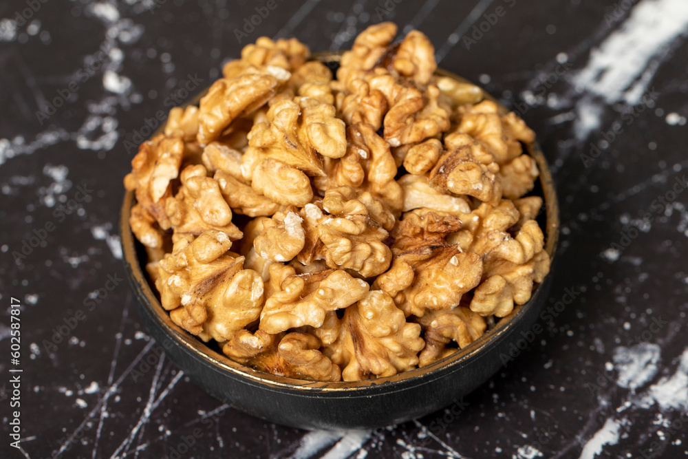 Walnut. Walnut kernel in bowl. Superfood. Vegetarian food concept. Healthy snacks. Close up Walnut. Walnut kernel in bowl. Superfood. Vegetarian food concept. Healthy snacks. Close up