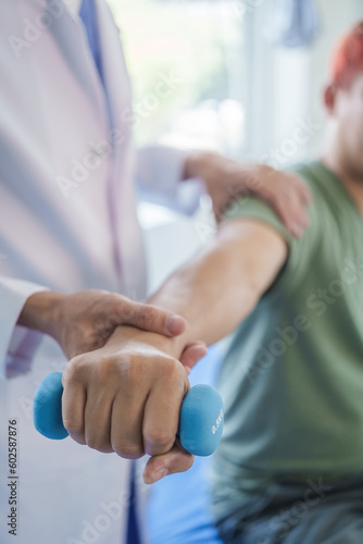 Professional massage therapist physiotherapy worker rehabilitation physiotherapy man at work with patient man client at clinic