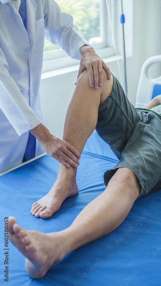 Fototapeta premium Professional massage therapist physiotherapy worker rehabilitation physiotherapy man at work with patient man client at clinic