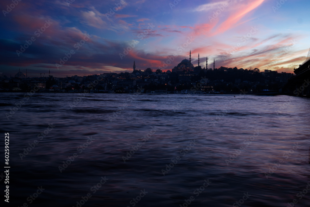 Beautiful sunset with clouds in Istanbul landscape with Mosque, Golden Horn, Istanbul Turkey
