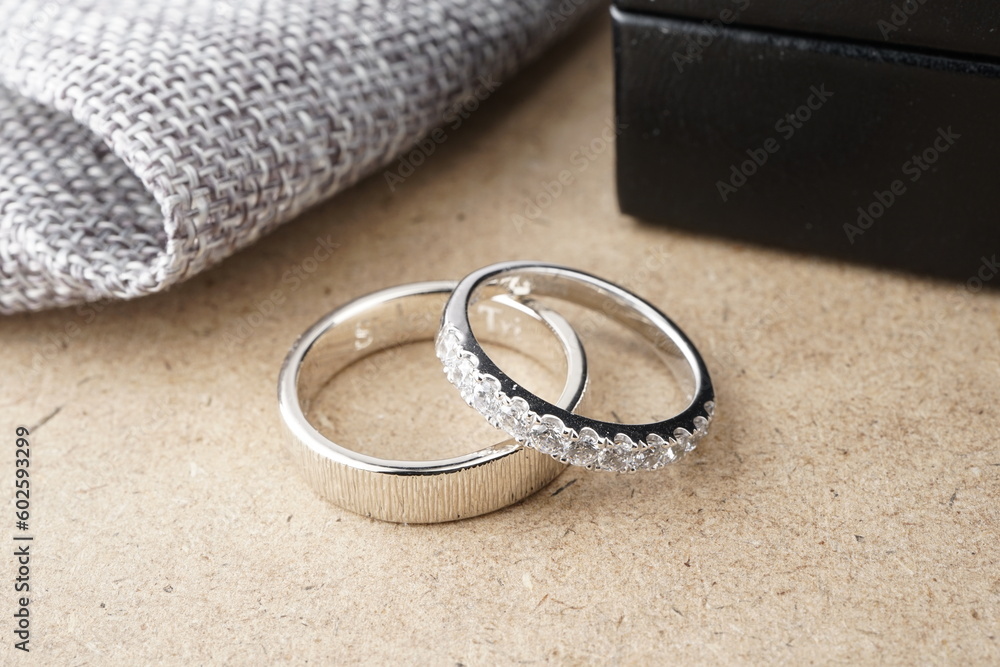 Silver wedding rings on a wooden background Silver wedding rings on a wooden background
