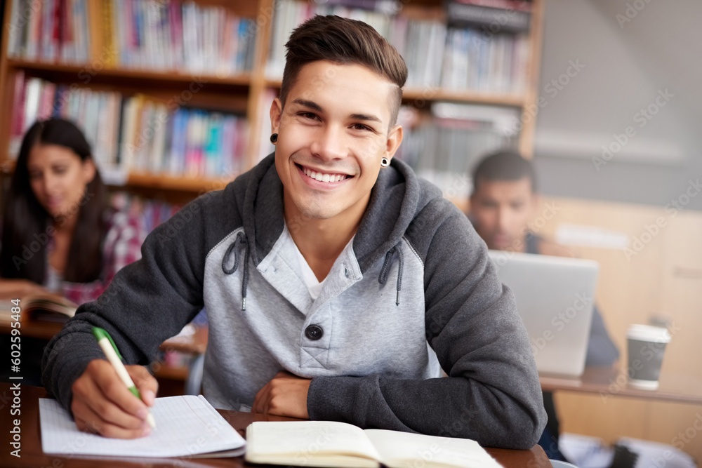 Learning, writing and college with portrait of man in library for education, research and classroom quiz. Focus, study and notebook with student at university for knowledge, scholarship and project Learning, writing and college with portrait of man in library for education, research and classroom quiz. Focus, study and notebook with student at university for knowledge, scholarship and project