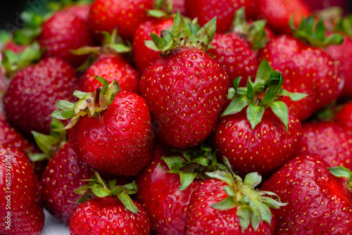 Fototapeta Naklejka Na Ścianę i Meble -  Red background of ripe strawberries. Close up, top view.