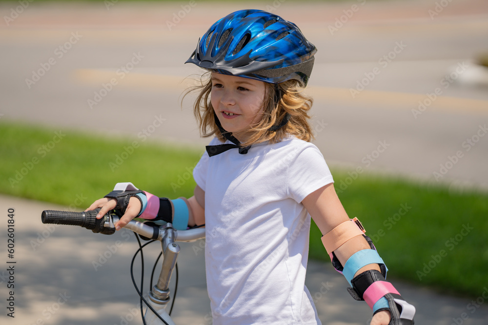 Kid riding bike on a summer park. Child in safety helmet riding bike. Boy riding bike wearing a helmet outside. Child in safety helmet riding bike. Little kid boy learns to ride a bicycle. Kid riding bike on a summer park. Child in safety helmet riding bike. Boy riding bike wearing a helmet outside. Child in safety helmet riding bike. Little kid boy learns to ride a bicycle.