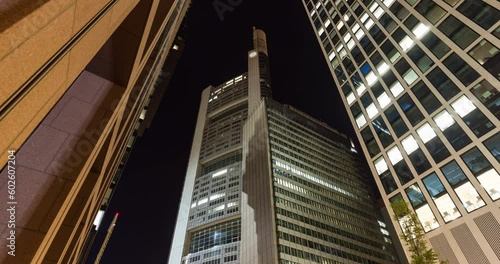 Modern skyscraper hypser lapse at night. Financial district of Frankfurt am Main, europe financial capital photo