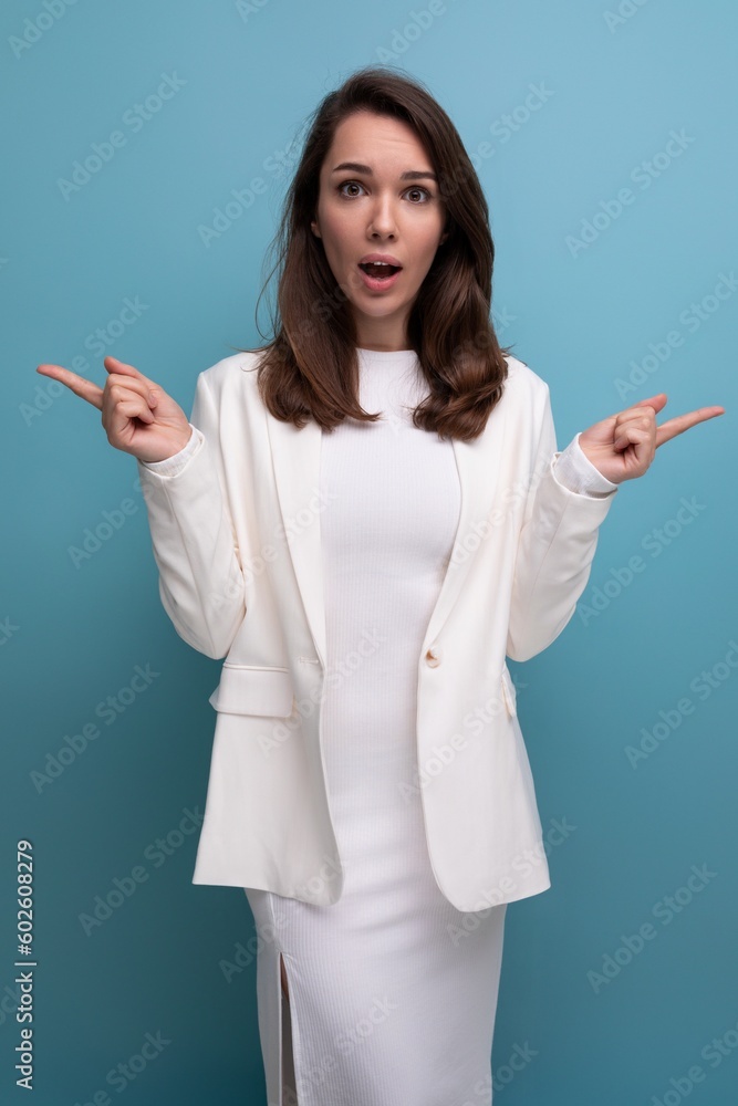 portrait of surprised shocked brunette woman in white dress with nice features portrait of surprised shocked brunette woman in white dress with nice features