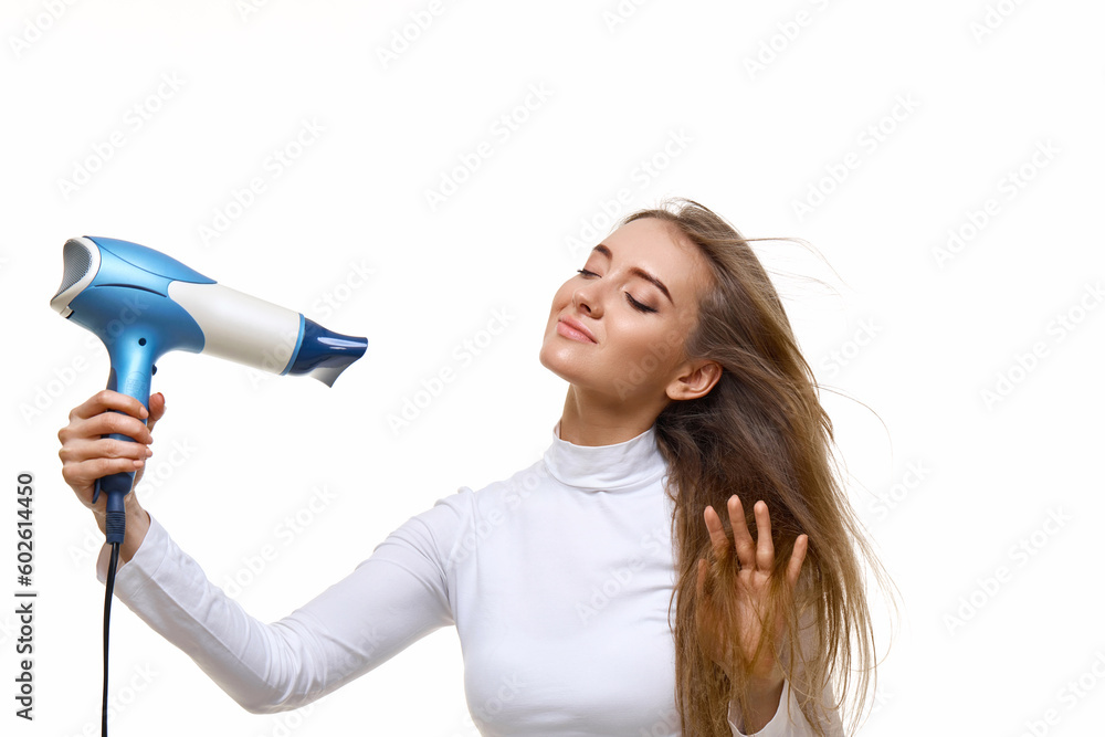 Portrait of attractive cheerful girl drying long hair Portrait of attractive cheerful girl drying long hair