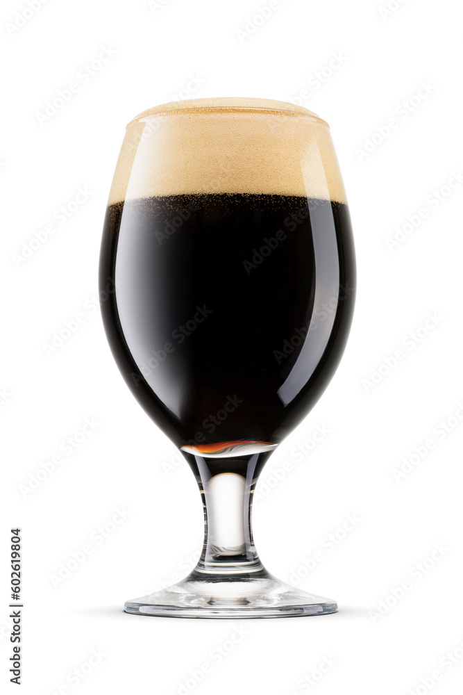 Snifter glass of fresh dark stout beer with cap of foam isolated