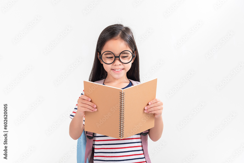 schoolgirl hugging book wearing backpack smiling isolated on white background schoolgirl hugging book wearing backpack smiling isolated on white background