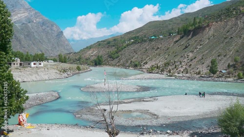 Confluence of Chandra and Bhaga rivers gives birth to Chenab river in Tandi, Lahaul and Spiti district, India. Beautiful landscape view of confluence of Himalayan rivers in Lahaul during summer day. photo