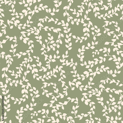 Seamless pattern of tree branches with small green leaves interwoven in an ornament