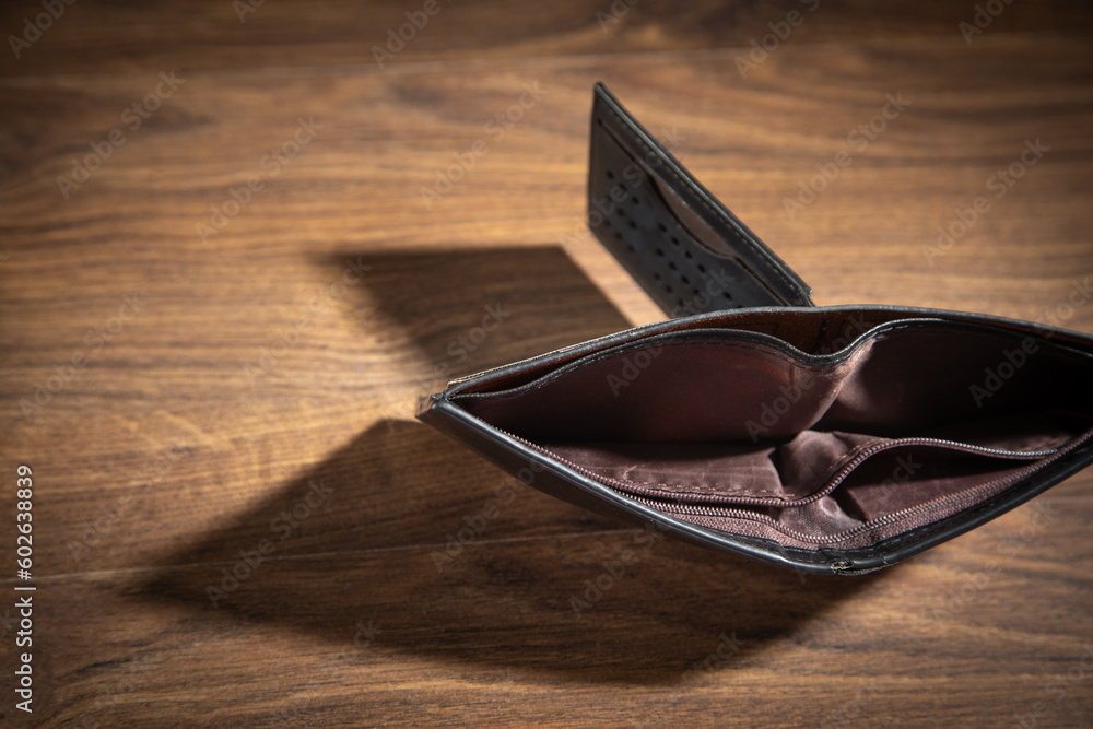 Empty wallet on the wooden table. Empty wallet on the wooden table.