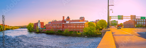 Manchester city skyline, Granite Street Bridge, and the Merrimack River at sunrise in New Hampshire, USA