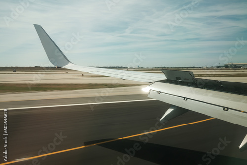 Side view of the airplane landing through the cabin window