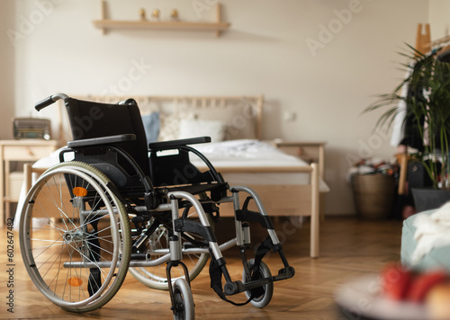 Close up of wheelchair in a bedroom.