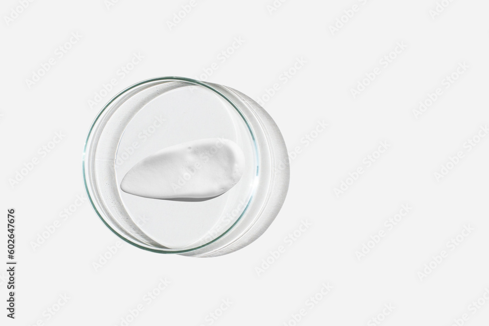 Foam, foam texture. Washing with foam. Foam in a Petri dish on a light background. Dab of cosmetic foam. Lab. Foam, foam texture. Washing with foam. Foam in a Petri dish on a light background. Dab of cosmetic foam. Lab.