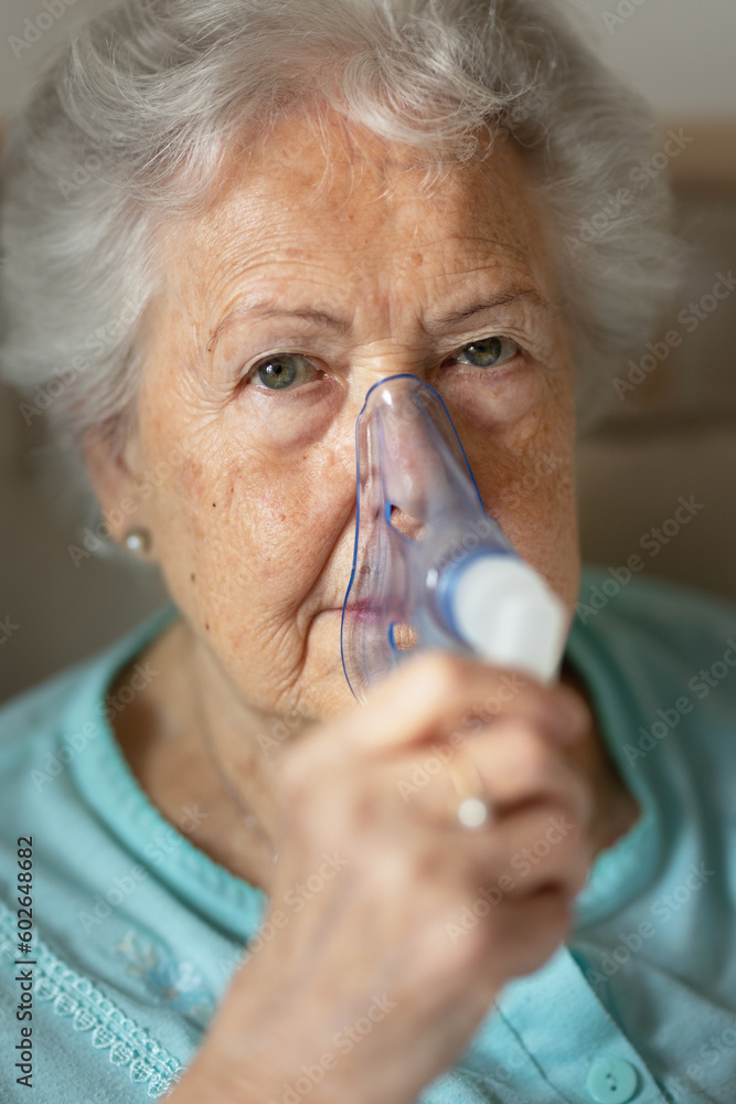 Portrait of senior woman with inhaller, healthcare concept. Portrait of senior woman with inhaller, healthcare concept.