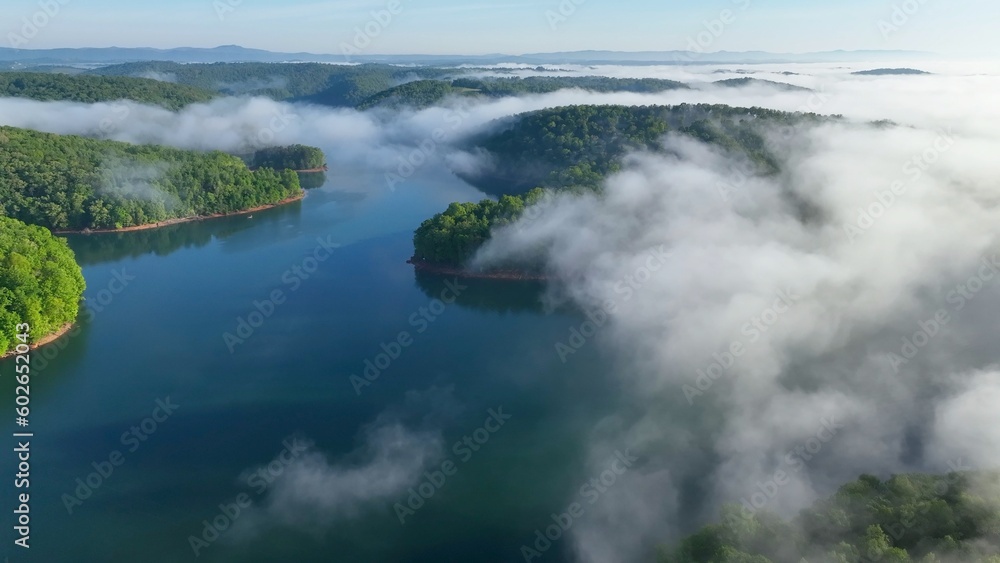 Landscape with lake beneath morning clouds and fog in mountains of Tennessee near Rocky Top at Norris Dam Landscape with lake beneath morning clouds and fog in mountains of Tennessee near Rocky Top at Norris Dam