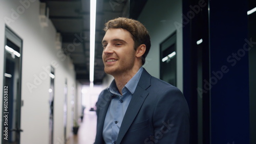 Wallpaper Mural Happy employee walking hall finishing work day closeup. Positive man executive Torontodigital.ca
