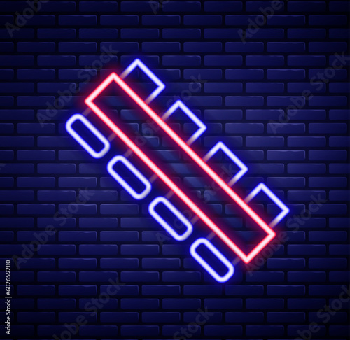 Glowing neon line Hunting cartridge belt with cartridges icon isolated on brick wall background. Bandolier sign. Hunter equipment, armament. Colorful outline concept. Vector