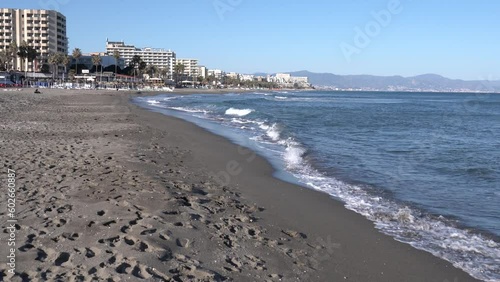 Benalmadena beach Spain towards Carihuela and Torremolinas Costa del Sol Andalusia Spain with sea and waves photo