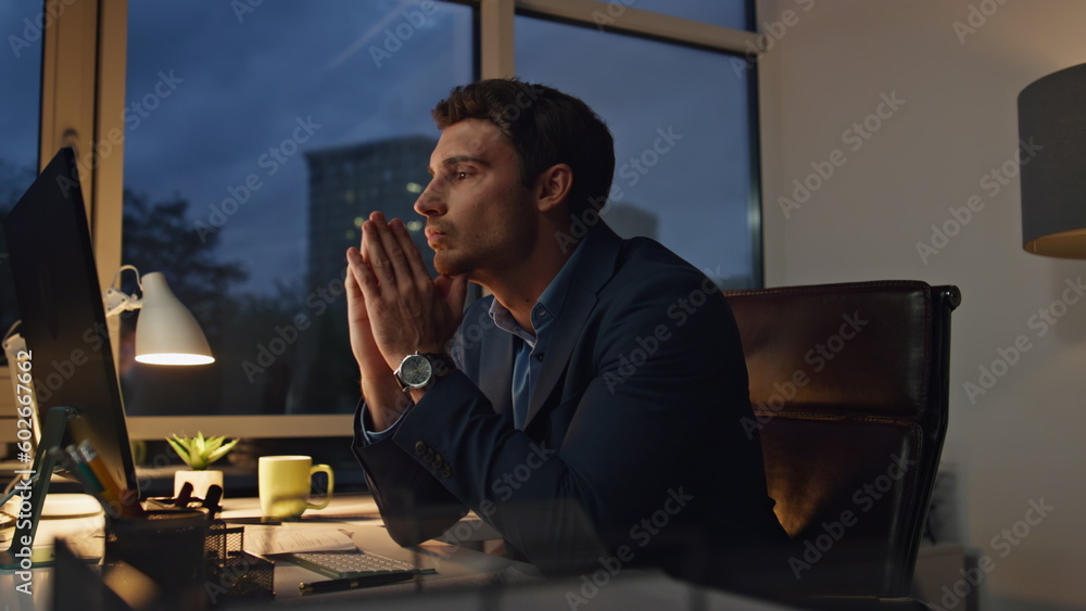 Concerned manager working late in office. Thoughtful businessman look solution Concerned manager working late in office. Thoughtful businessman look solution
