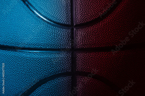 Closeup detail of blue and red basketball ball texture background. Horizontal sport theme poster, greeting cards, headers, website and app © Augustas Cetkauskas