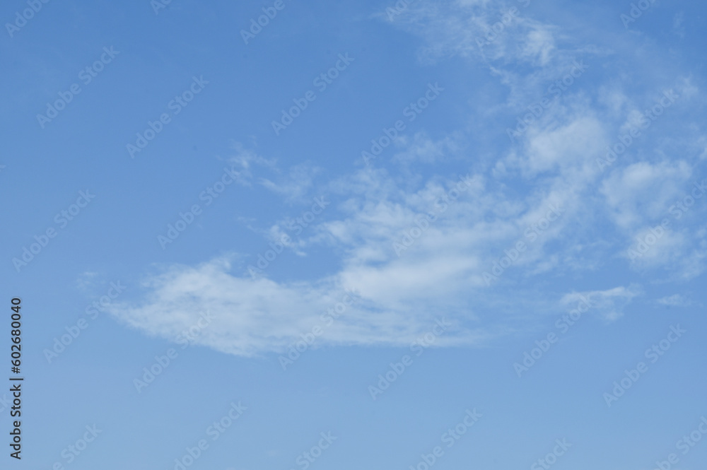 Blue sky background with white clouds  look like happy dragon and her group.