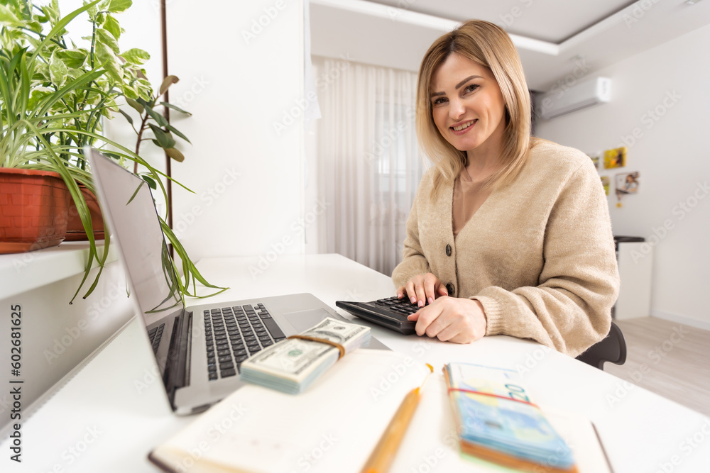 woman pays taxes on laptop