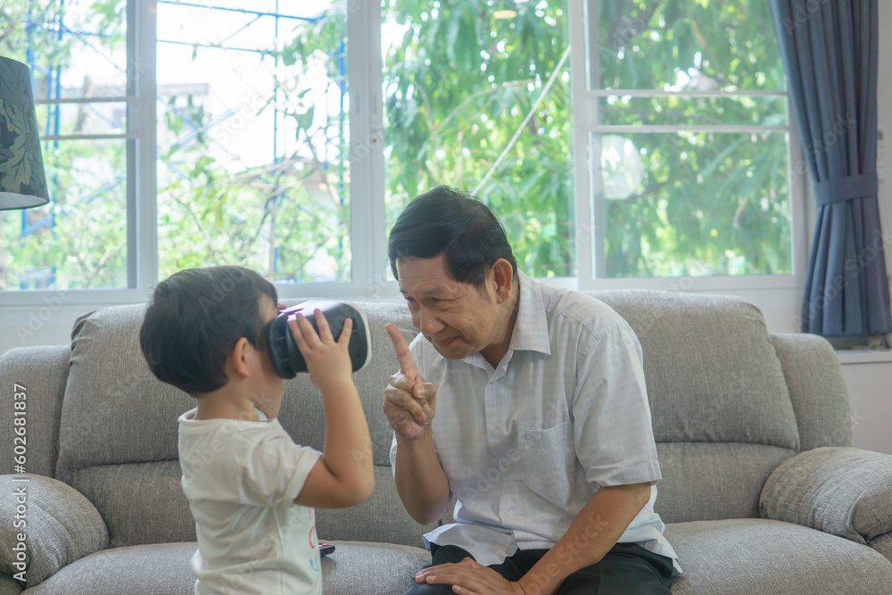 Grandfather and grandson playing vr game at home. Grandfather and grandson playing vr game at home.