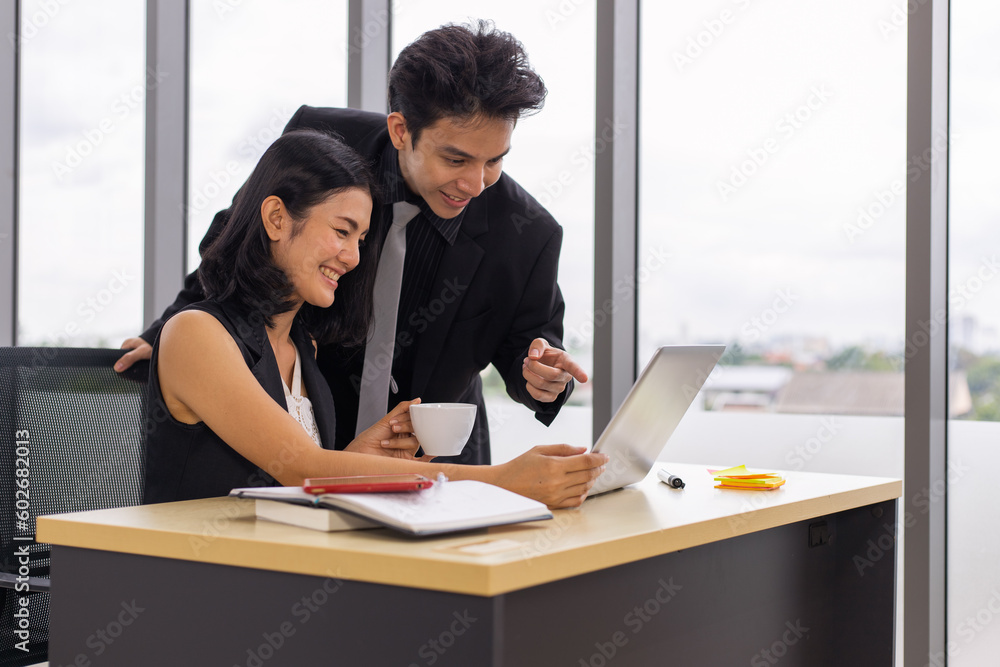 Young businessman and businesswoman using laptop and consultation together. Young businessman and businesswoman using laptop and consultation together.