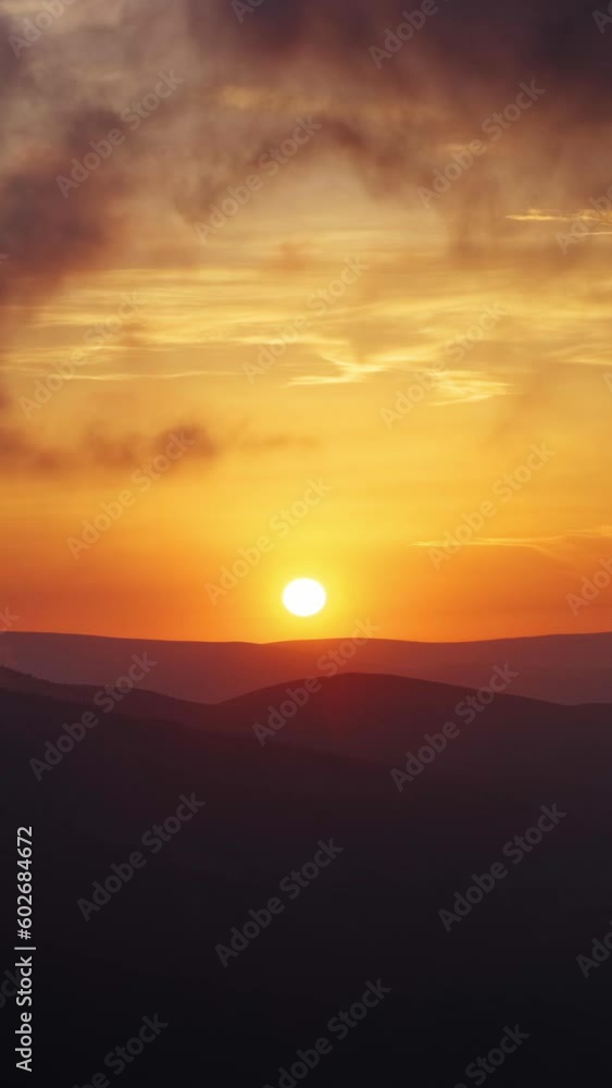 Beautiful mountain landscape with dramatic sunset in clouds, timelapse. Vertical video Beautiful mountain landscape with dramatic sunset in clouds, timelapse. Vertical video