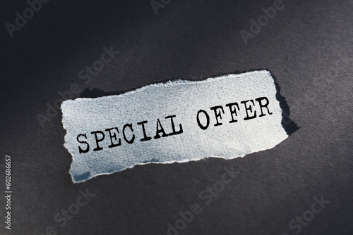 Special offer text on torn paper on craft paper background