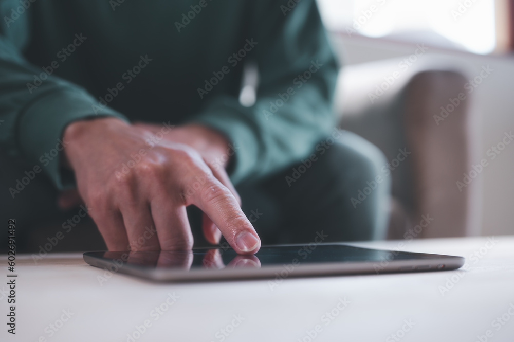 businessman sitting on sofa using molile tablet browsing on internet network platform, business analysing and strategy