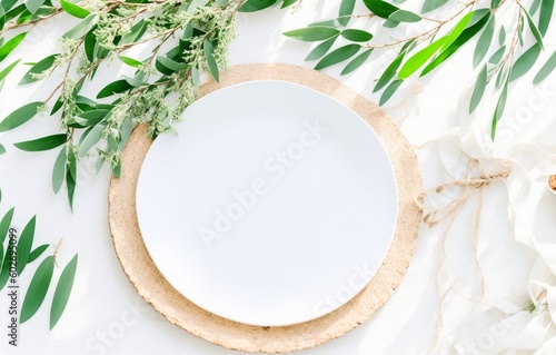 Summer wedding stationery mock-up scene. Blank greeting card, olive tree leaves and branches in sunlight. White table background with palm shadows, generative ai