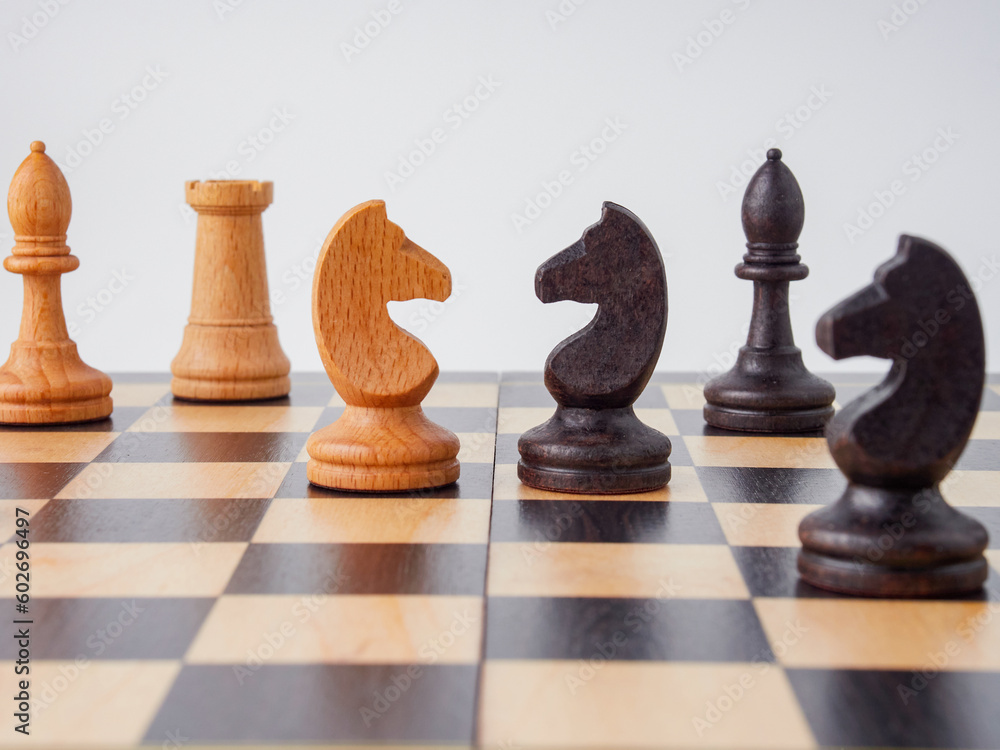 Set of wooden chessboard with chess pieces isolated on white background Set of wooden chessboard with chess pieces isolated on white background