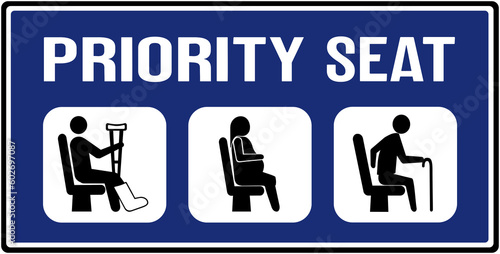 A sign in blue color that says in Portuguese language : priority seat . Preferential seat