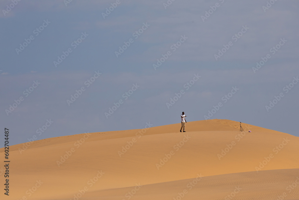 person walking through the Namib desert