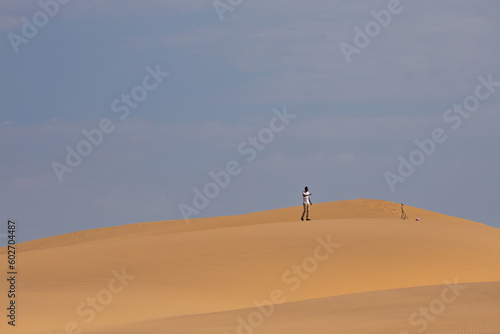 person walking through the Namib desert