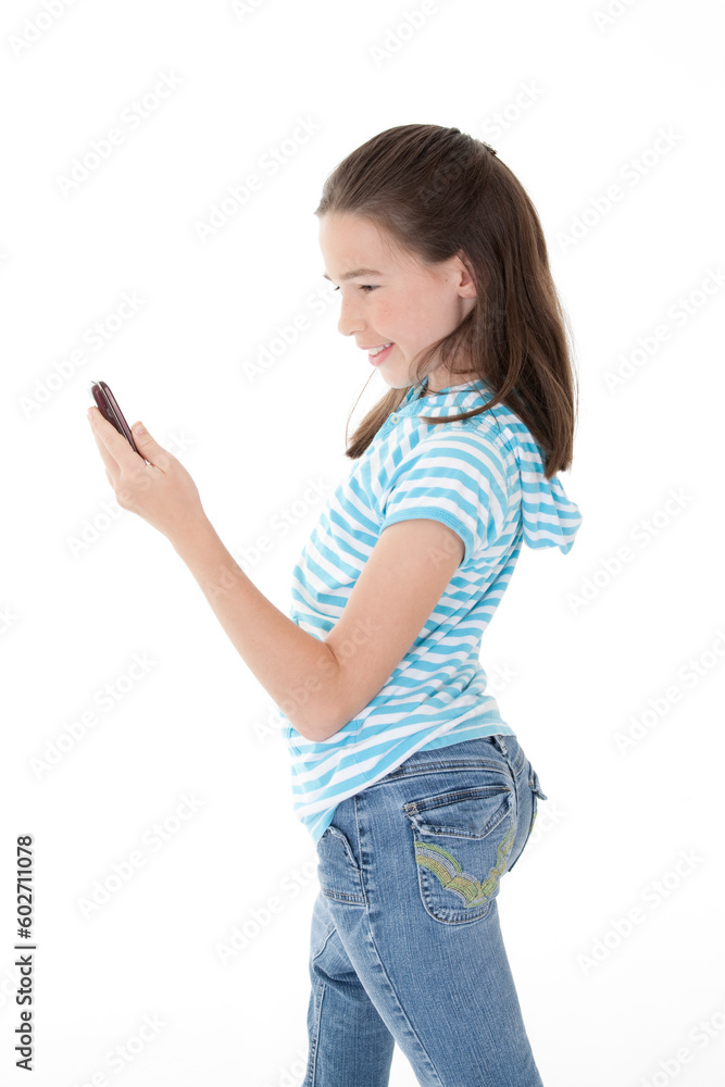 Cute Caucasian girls texting on a cell phone Cute Caucasian girls texting on a cell phone