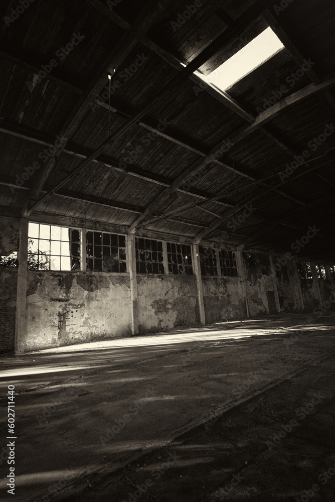 Abandoned building in sepia tones on a sunny summer day.	