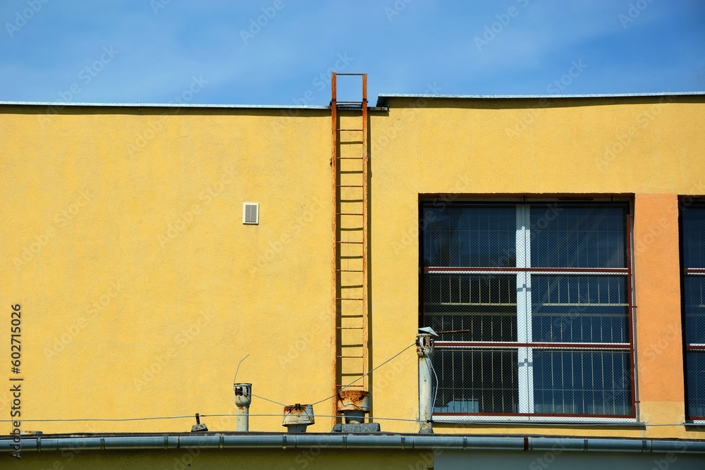 Ladder leading to the top of the building Ladder leading to the top of the building