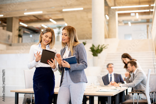 Two young business women lo...