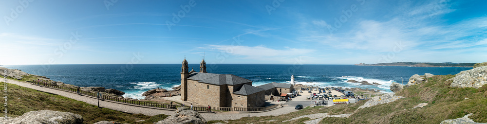 Panoramic view of a church by the sea in Muxía, A Coruña