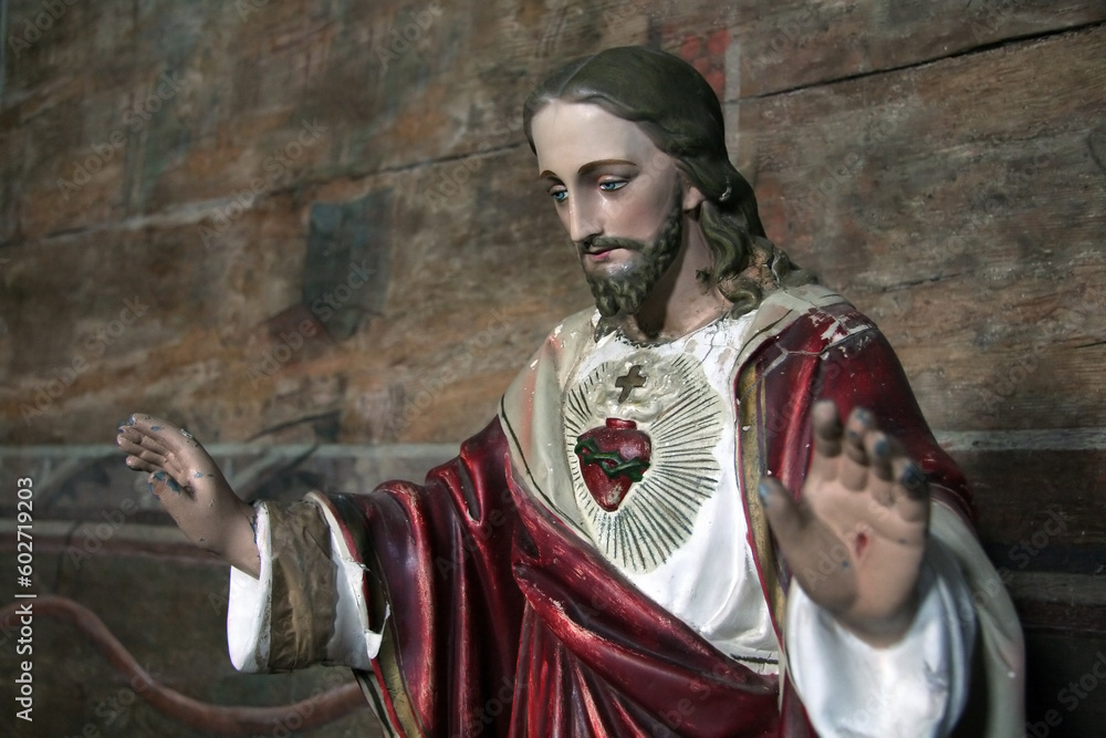 Obraz premium old wooden jesus sculpture, photo taken in an old church in Krosno, Poland