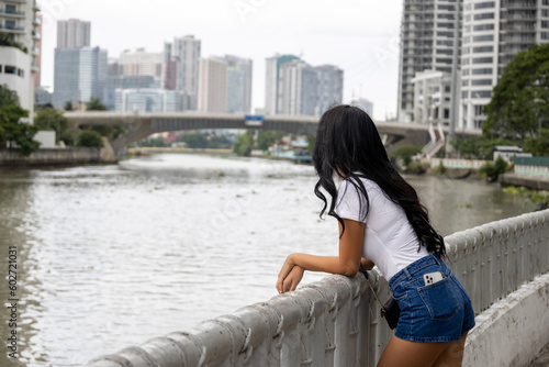 long hair back girl watching the river