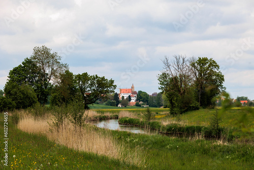 View of the Gablinger castle over the green meadows and fields in the Schmutter valley near Augsburg photo