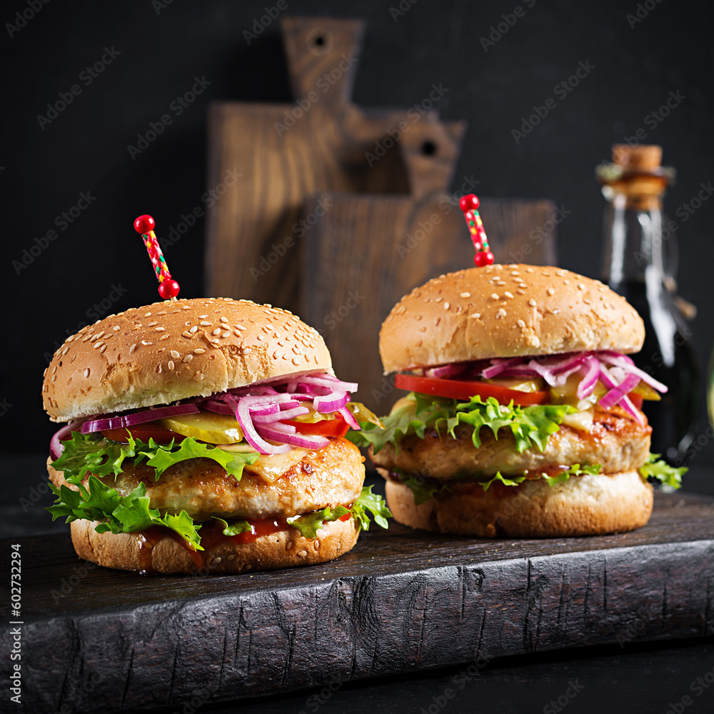Chicken hamburger. Sandwich with chicken burger, tomatoes, cheese and lettuce. Cheeseburger. Chicken hamburger. Sandwich with chicken burger, tomatoes, cheese and lettuce. Cheeseburger.
